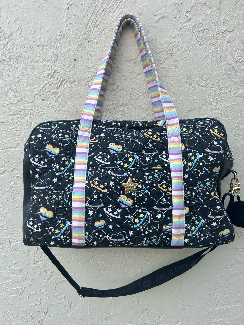 Luv Betsey Johnson quilted galaxy weekender bag with rainbow straps.